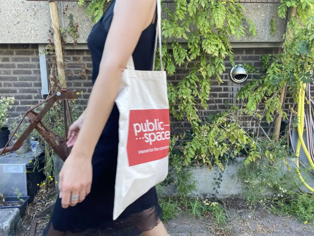 person with publicspaces bag